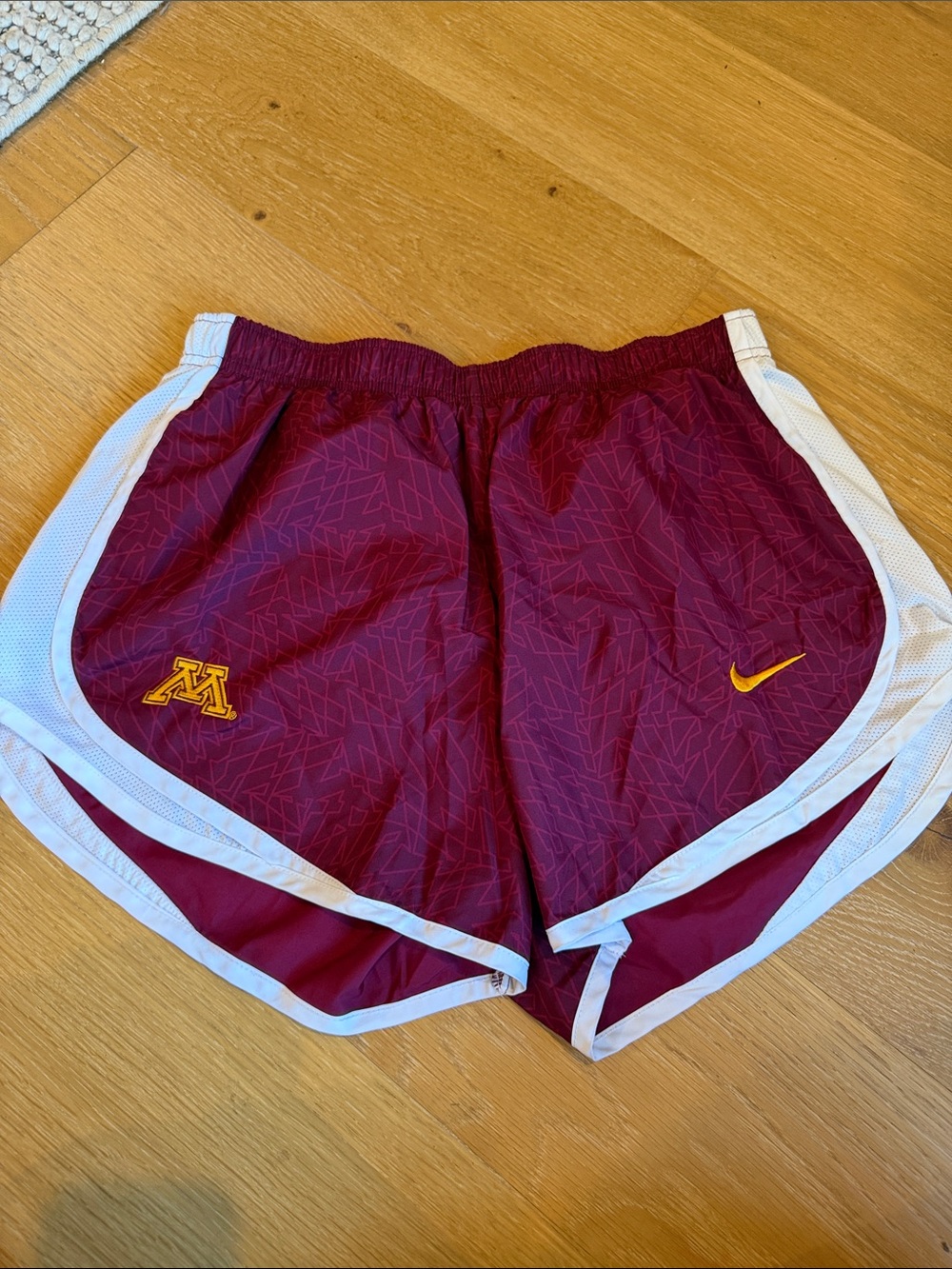 Nike Maroon Athletic Shorts with White Trim and Gold Logos